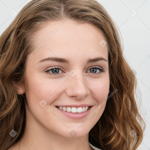 Joyful white young-adult female with long  brown hair and blue eyes