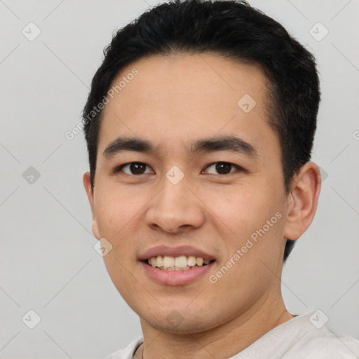 Joyful white young-adult male with short  black hair and brown eyes