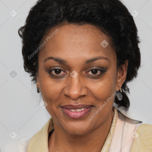Joyful black adult female with long  brown hair and brown eyes