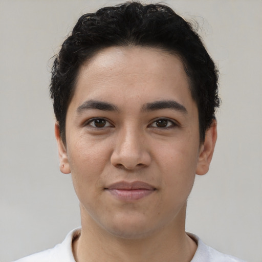 Joyful white young-adult male with short  black hair and brown eyes