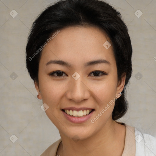 Joyful asian young-adult female with short  black hair and brown eyes