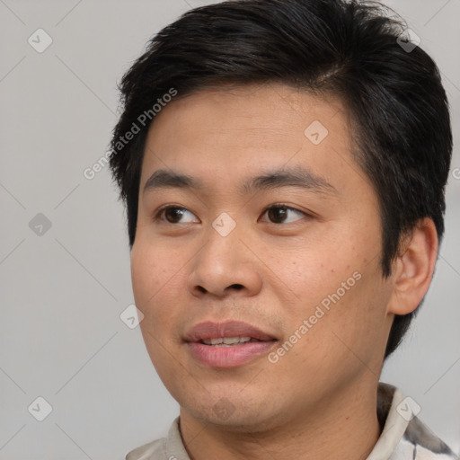 Joyful asian young-adult male with short  brown hair and brown eyes