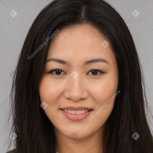 Joyful asian young-adult female with long  brown hair and brown eyes