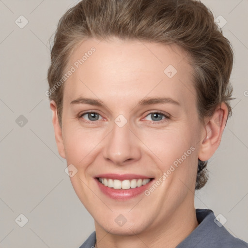 Joyful white young-adult female with short  brown hair and grey eyes