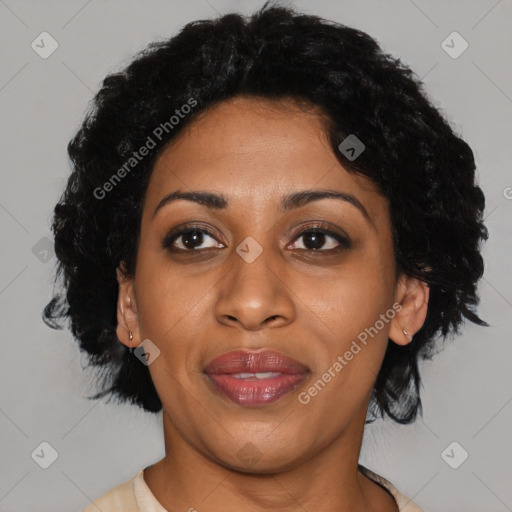 Joyful black adult female with short  brown hair and brown eyes