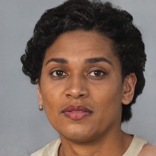 Neutral black adult female with short  black hair and brown eyes