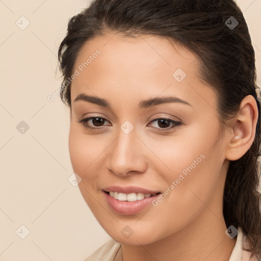 Joyful white young-adult female with long  brown hair and brown eyes