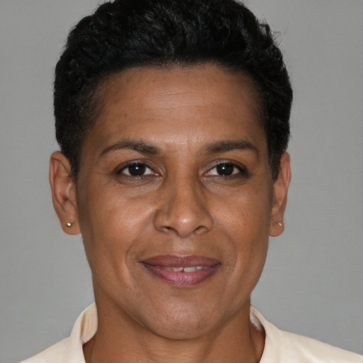 Joyful black adult female with short  brown hair and brown eyes