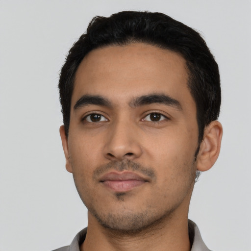 Neutral latino young-adult male with short  black hair and brown eyes