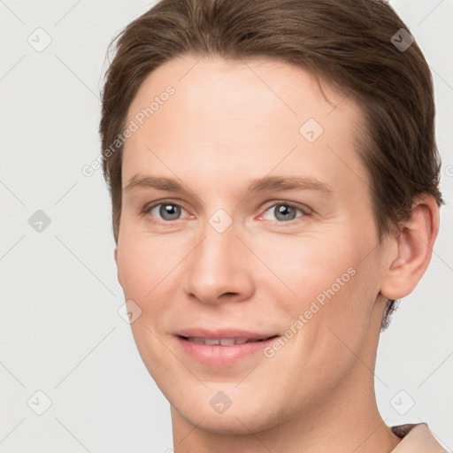 Joyful white young-adult female with short  brown hair and grey eyes