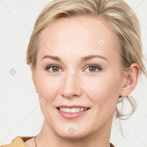 Joyful white young-adult female with medium  brown hair and blue eyes