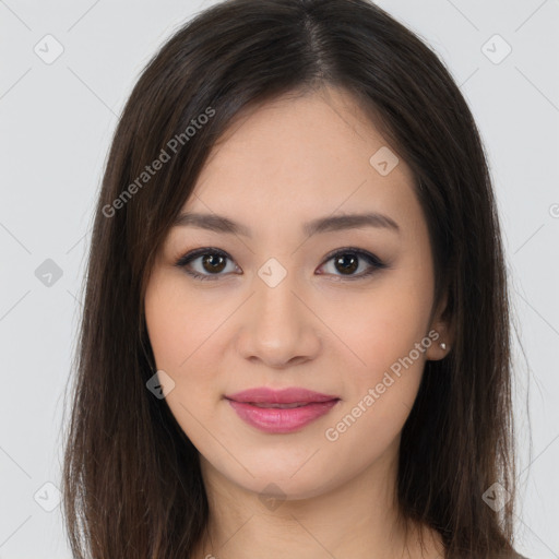 Joyful asian young-adult female with long  brown hair and brown eyes