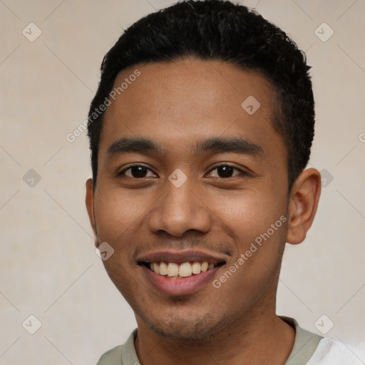 Joyful latino young-adult male with short  black hair and brown eyes