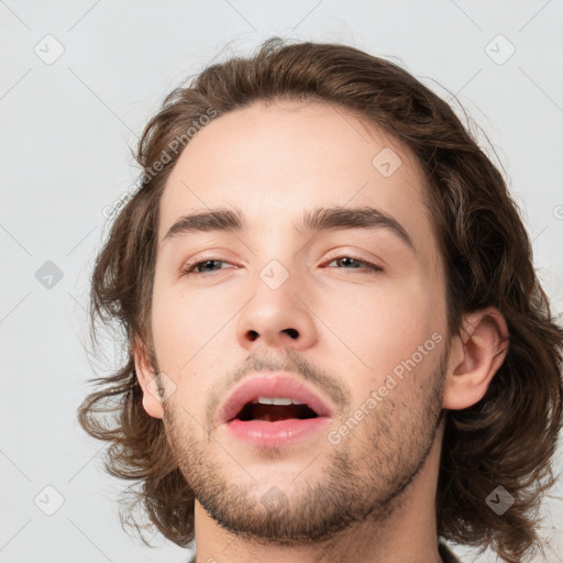 Neutral white young-adult male with medium  brown hair and brown eyes