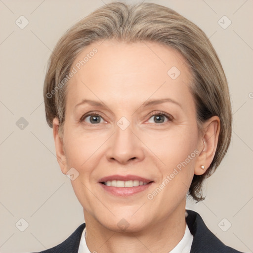 Joyful white adult female with medium  brown hair and grey eyes