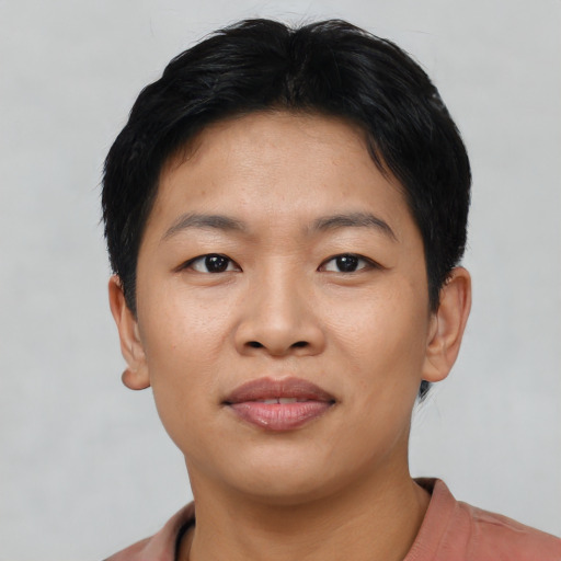 Joyful asian young-adult female with short  black hair and brown eyes