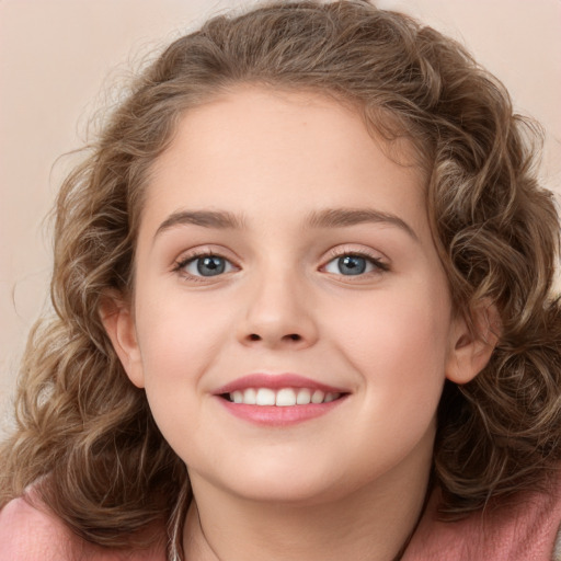 Joyful white child female with medium  brown hair and green eyes