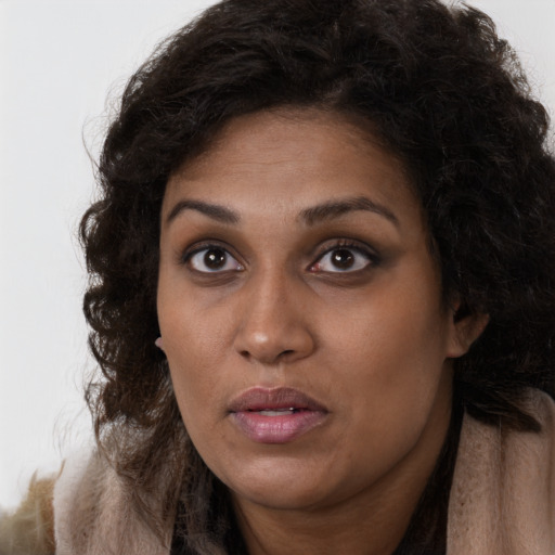 Neutral black young-adult female with long  brown hair and brown eyes