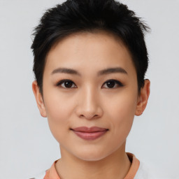 Joyful asian young-adult female with short  brown hair and brown eyes