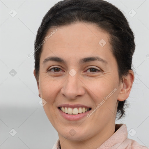 Joyful white young-adult female with short  brown hair and brown eyes