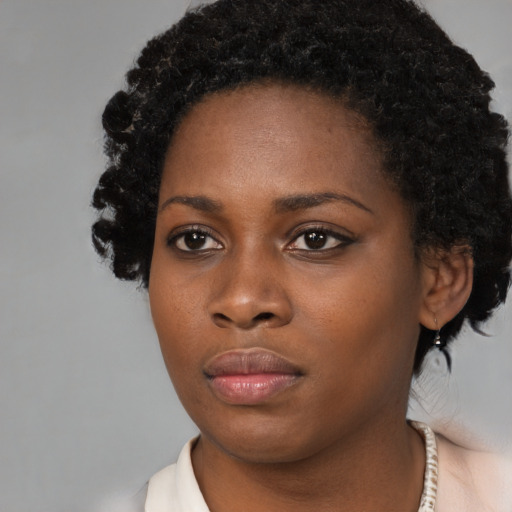 Neutral black young-adult female with medium  black hair and brown eyes