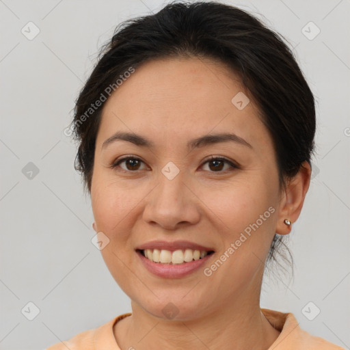 Joyful white adult female with medium  brown hair and brown eyes