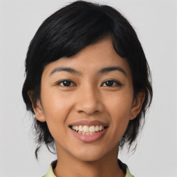 Joyful asian young-adult female with medium  black hair and brown eyes