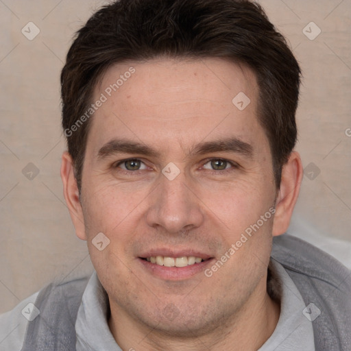 Joyful white adult male with short  brown hair and brown eyes