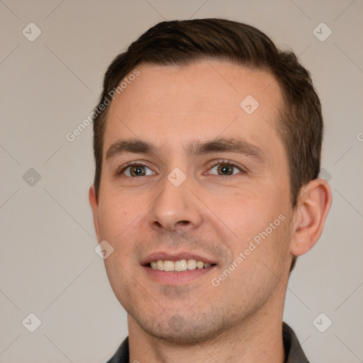 Joyful white young-adult male with short  brown hair and brown eyes