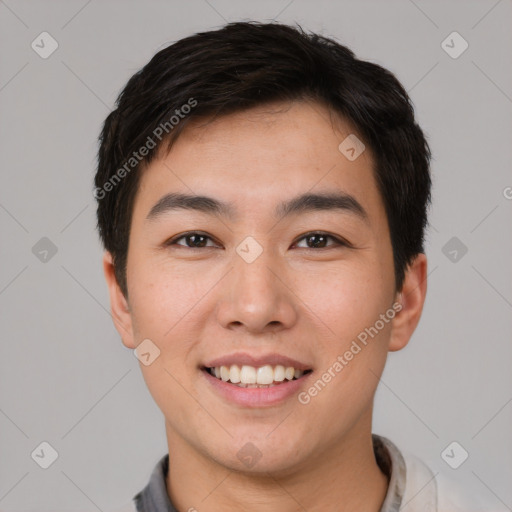 Joyful white young-adult male with short  black hair and brown eyes