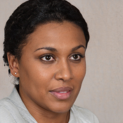 Neutral black young-adult female with short  brown hair and brown eyes