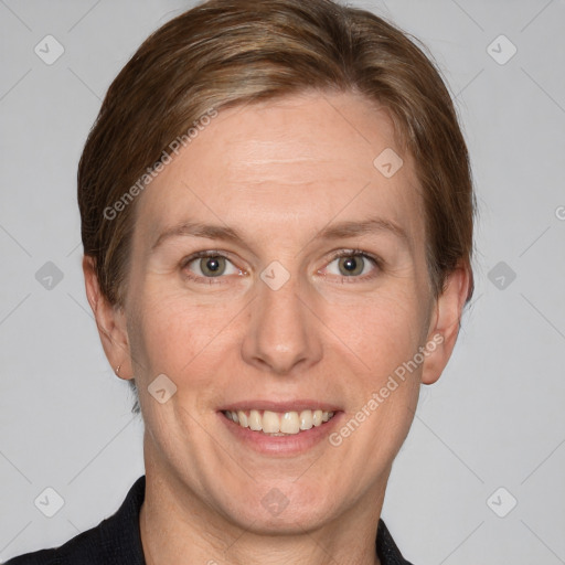 Joyful white adult female with short  brown hair and grey eyes