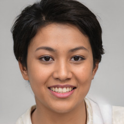 Joyful asian young-adult female with short  brown hair and brown eyes