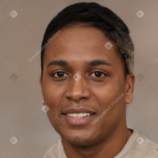 Joyful black young-adult male with short  black hair and brown eyes