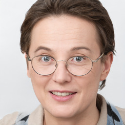 Joyful white adult female with short  brown hair and grey eyes