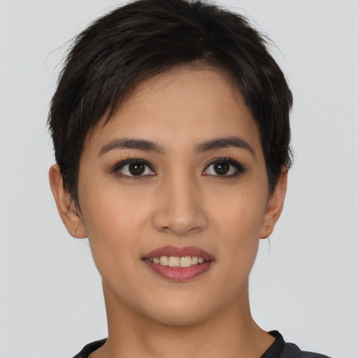 Joyful asian young-adult female with short  brown hair and brown eyes