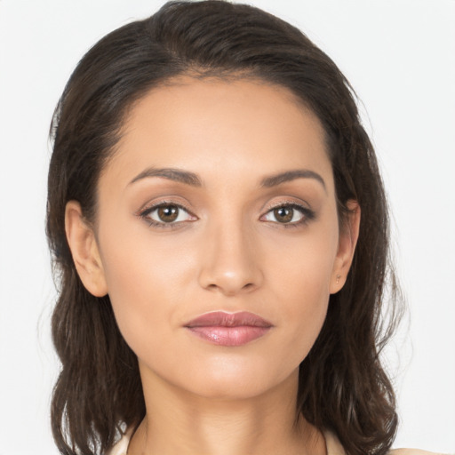 Joyful white young-adult female with long  brown hair and brown eyes