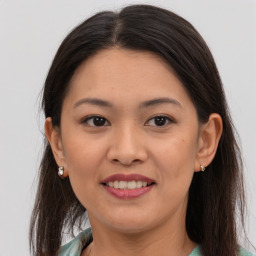 Joyful white young-adult female with medium  brown hair and brown eyes