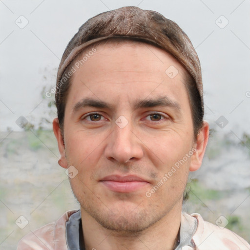 Joyful white adult male with short  brown hair and brown eyes