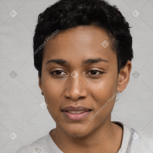 Joyful black young-adult female with short  black hair and brown eyes