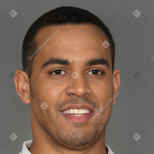 Joyful black young-adult male with short  brown hair and brown eyes