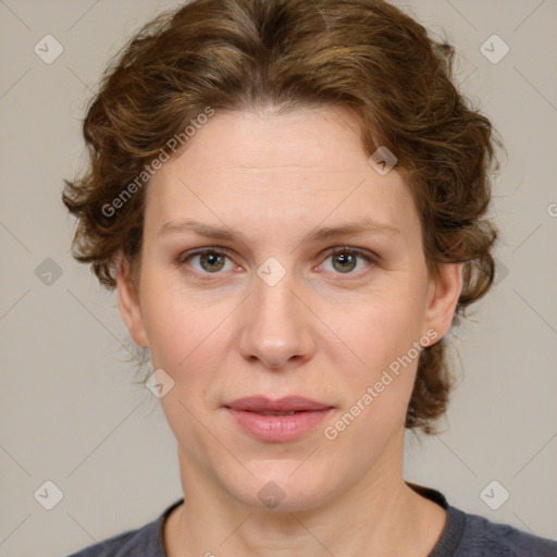 Joyful white young-adult female with medium  brown hair and green eyes