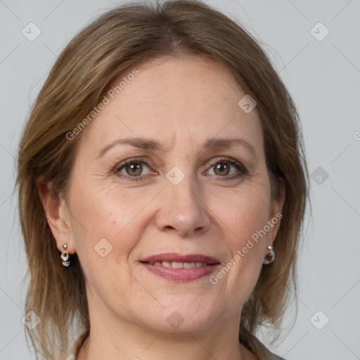 Joyful white adult female with medium  brown hair and grey eyes