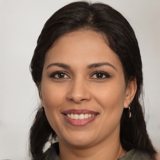 Joyful white young-adult female with medium  brown hair and brown eyes