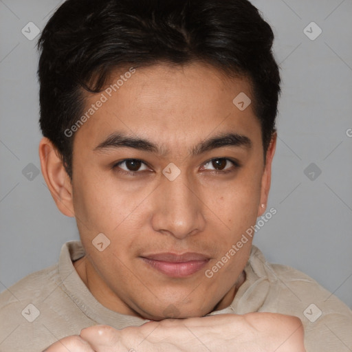 Joyful latino young-adult male with short  brown hair and brown eyes