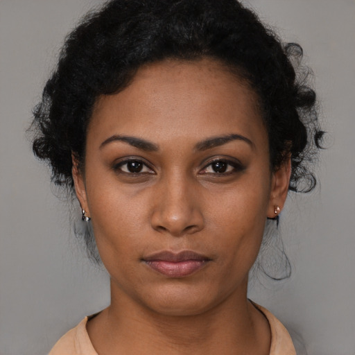 Neutral black young-adult female with medium  black hair and brown eyes