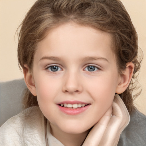 Joyful white child female with medium  brown hair and brown eyes