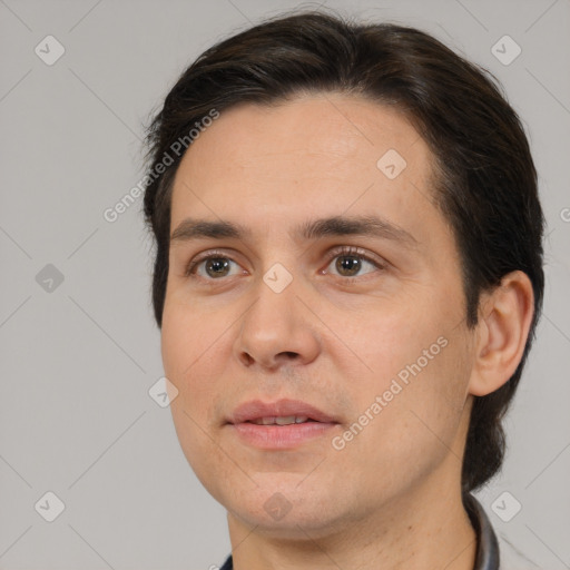 Joyful white adult male with short  brown hair and brown eyes