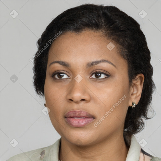 Joyful black young-adult female with medium  brown hair and brown eyes