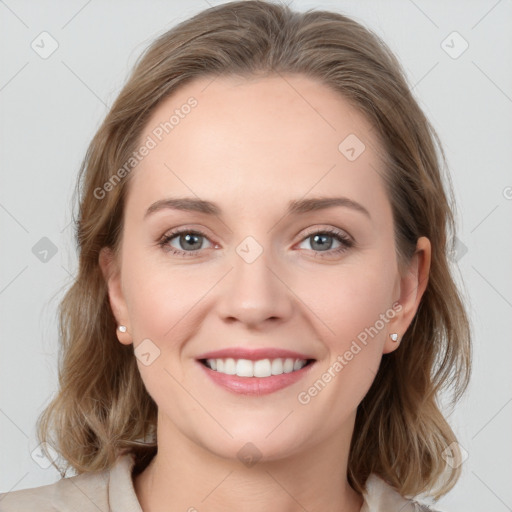 Joyful white young-adult female with medium  brown hair and blue eyes